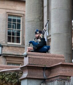 Scottish Piper at Birkenhead Town Hall playing lament by Cenotaph